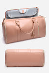 The Smart No-Wrinkle Foldable Travel Bag Pink by The Windbreaker Jacket is a large, lightweight and portable duffel bag featuring a zippered main compartment, two handles, and a shoulder strap. Displayed with the top flap partially open, the interior reveals a light blue lining. Made from waterproof PU leather, the bottom view of the bag is also shown.